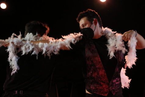 Ellis Vogt dances with a feather boa during Mary Wests performance of All I Care About from Chicago. The song was one of many during the Twisted Theatre performance on Saturday.