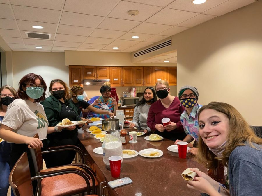 Members of the Global Unity Club and the Black Student Union at a cooking event in Latour.