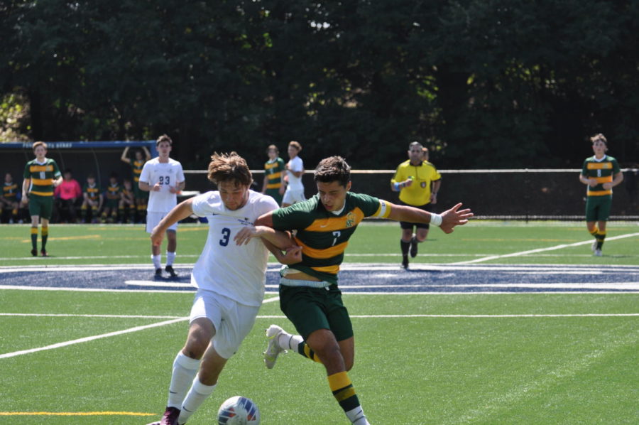 Pacers captain Chris Valdes battles for the ball against Penn State Berks