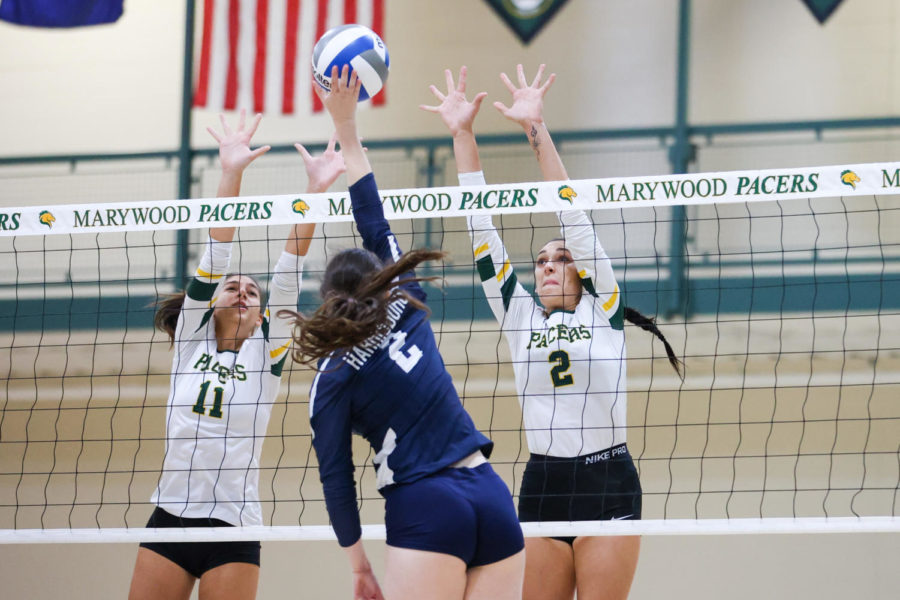 Shannon Corr (2) and Casey Hagerstrom (11) go for the block against Penn State Harrisburg