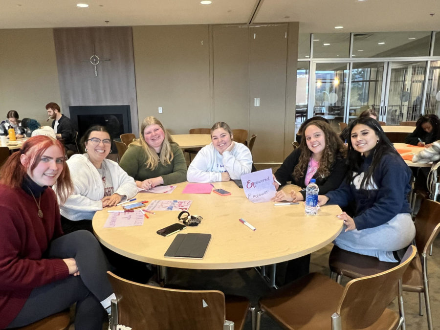 Members of the Female Empowerment Club gather to discuss women's rights and encourage female empowerment.