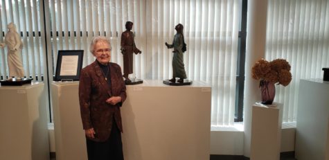 Sr. Cor Immaculatum, IHM, poses among some of her favorite pieces.