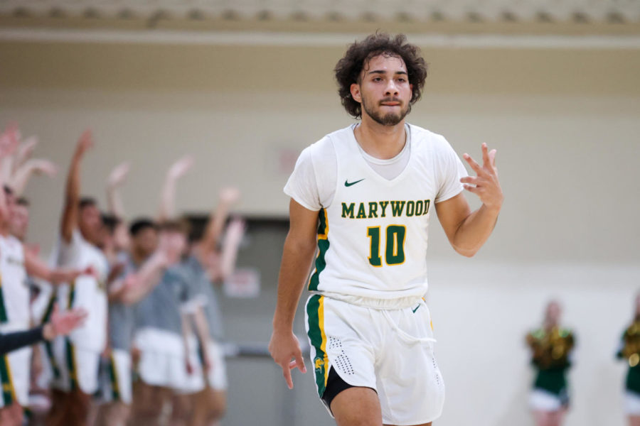 Mason Mendygral (10) celebrates a three-pointer