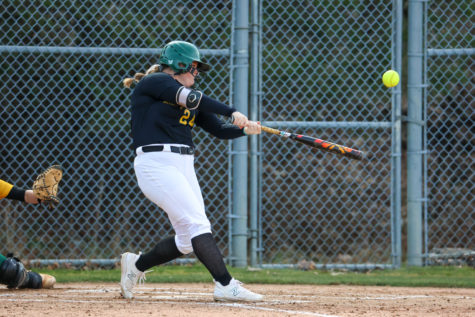 Sophomore Emily McNally wallops a home run in a victory against SUNY Delhi.