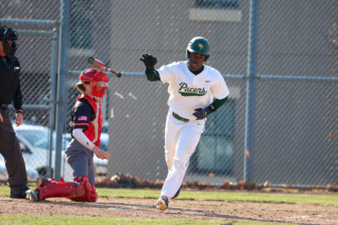 Junior Chris Taylor draws a walk in the Pacers home opener.
