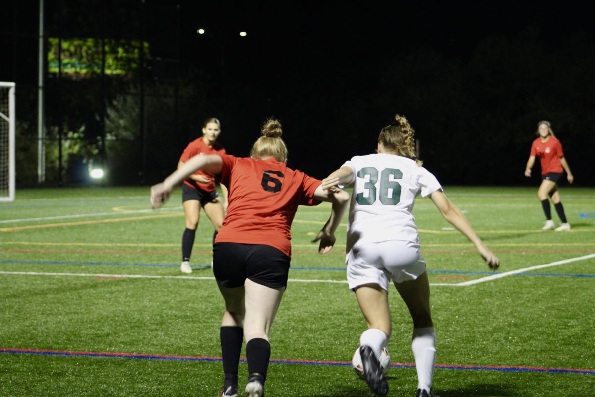 Pacers' midfielder Colleen O'Brien battles off the defender to keep the Pacers' attack alive.