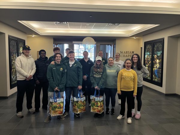 Volunteers gathered to organize bags of food to be donated to families in the community.